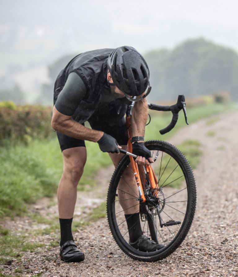 Somebody using a pump from BBB Cycling to pump up the tyre